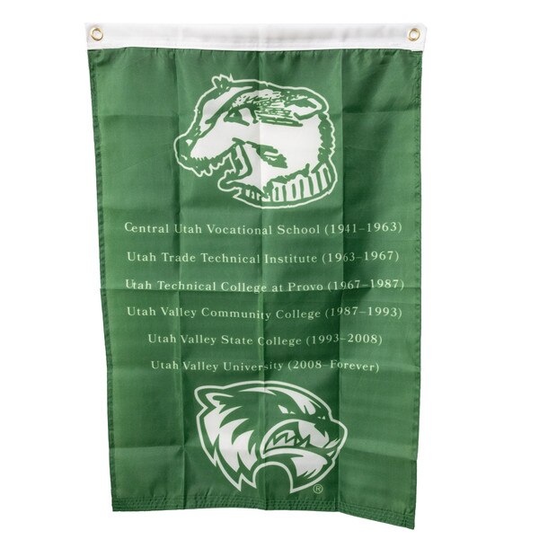 2x3 Foot green hanging flag with grommets. Featuring the history of the university, including all the previous names and dates of UVU with the first iteration of the mascot head logo and the newest o